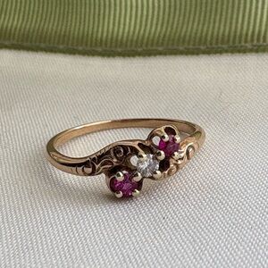 Elegant Rose Gold Diamond and Red Gemstone Ring with Floral Design